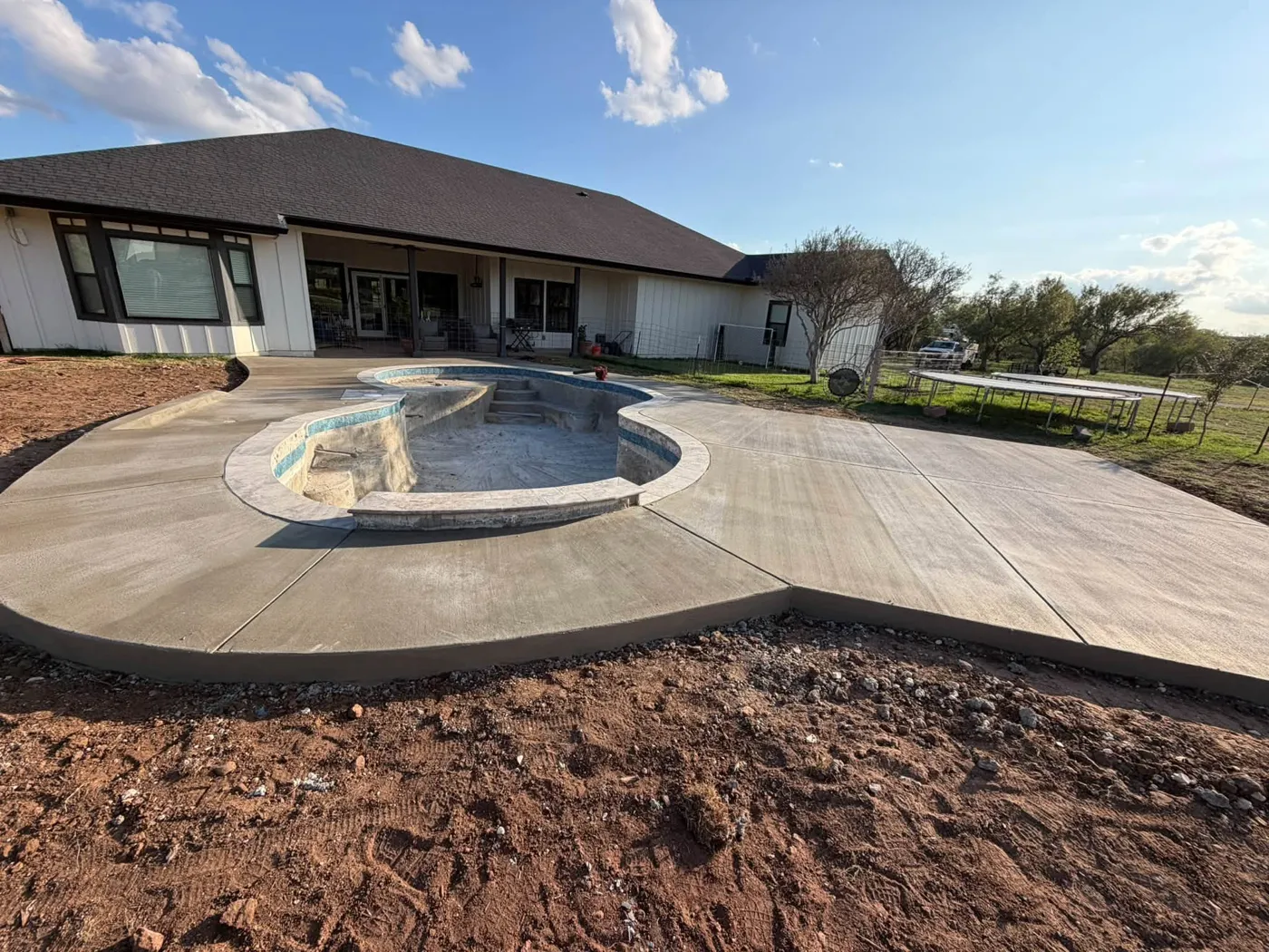 Spa & deck by JGH Concrete